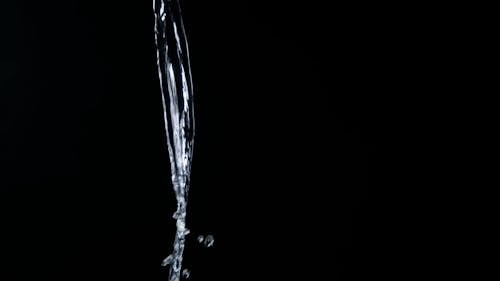 High-Speed Photography of Water Splash Against Black Background