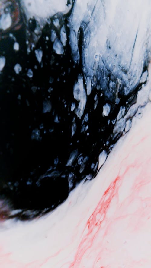 Close-Up Shot of a Black Abstract Painting