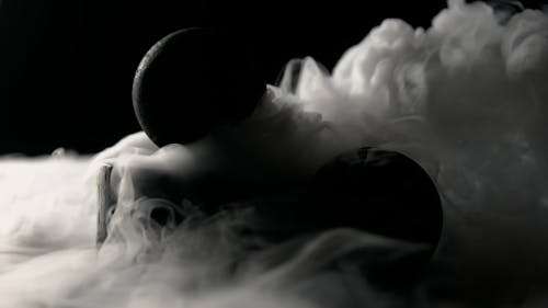Black Balls Surrounded by Smoke
