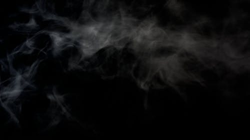 White smoke against black backdrop