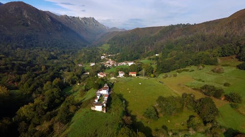 Drone shot of houses and mountains