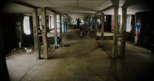 Friends Skateboarding Inside an Abandoned Building