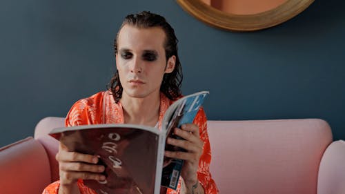 A Man Reading a Magazine