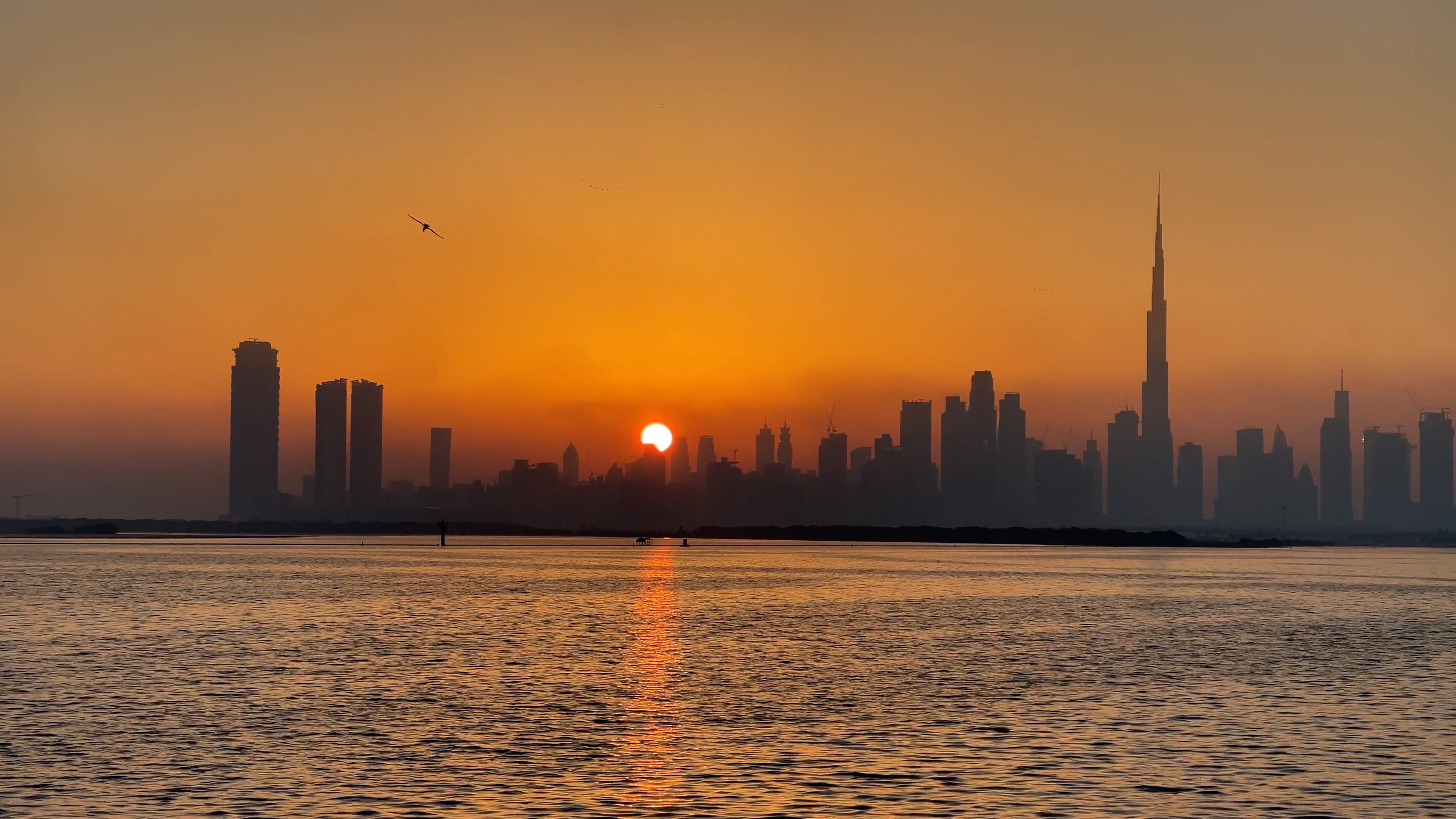 Skyline of city across water at sunset Free Stock Video Footage ...