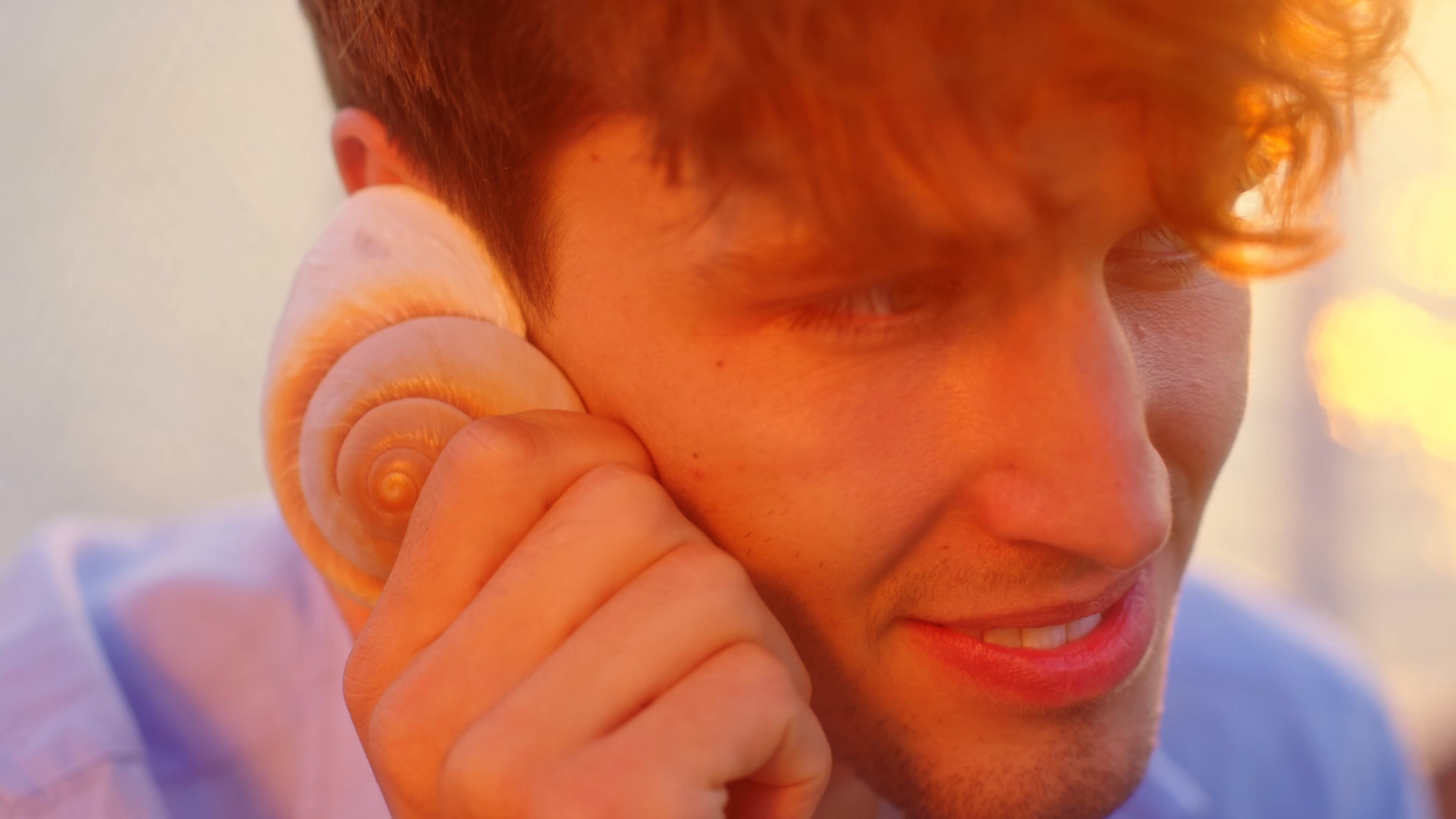 A Man Putting a Sea Shell on his Ear Free Stock Video Footage, Royalty ...