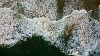 sea waves splashing on shore