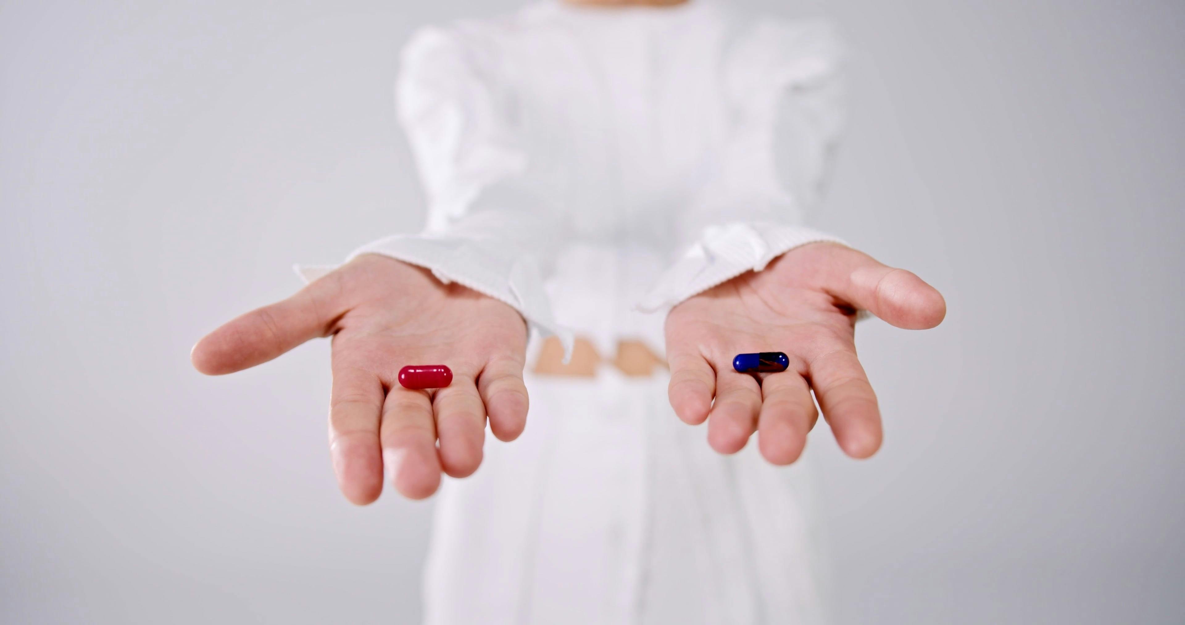 A Woman Handing Out a Blue and a Red Pill Free Stock Video Footage,  Royalty-Free 4K & HD Video Clip