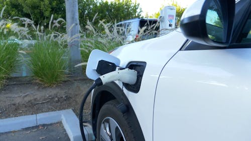 A White Electric Car Charging