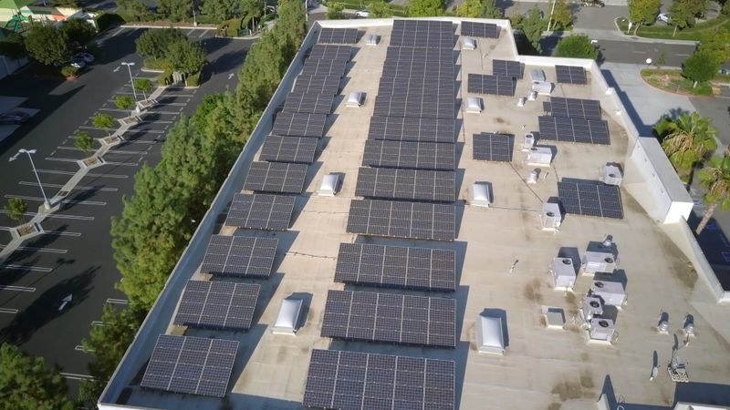 Aerial close-up of a rooftop covered in solar panels