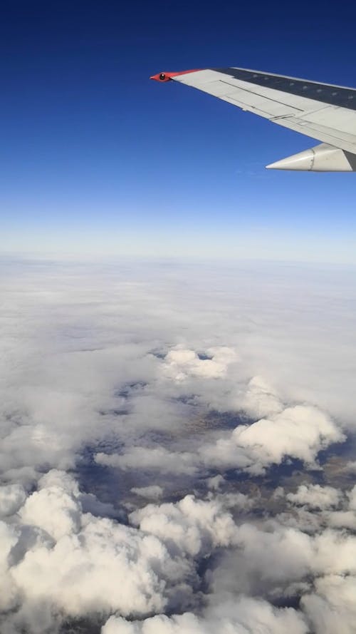 View of Blue Sky and Clouds From an Airplane