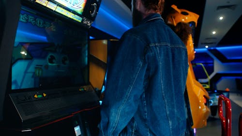 A Couple Dancing in an Arcade Game 
