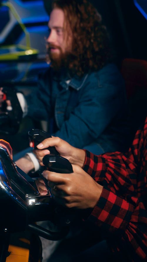 Man Playing Arcade Machine