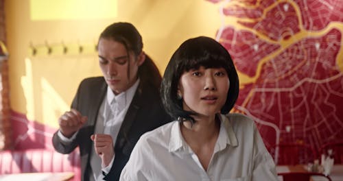 A Man and a Woman Dancing in a Restaurant 