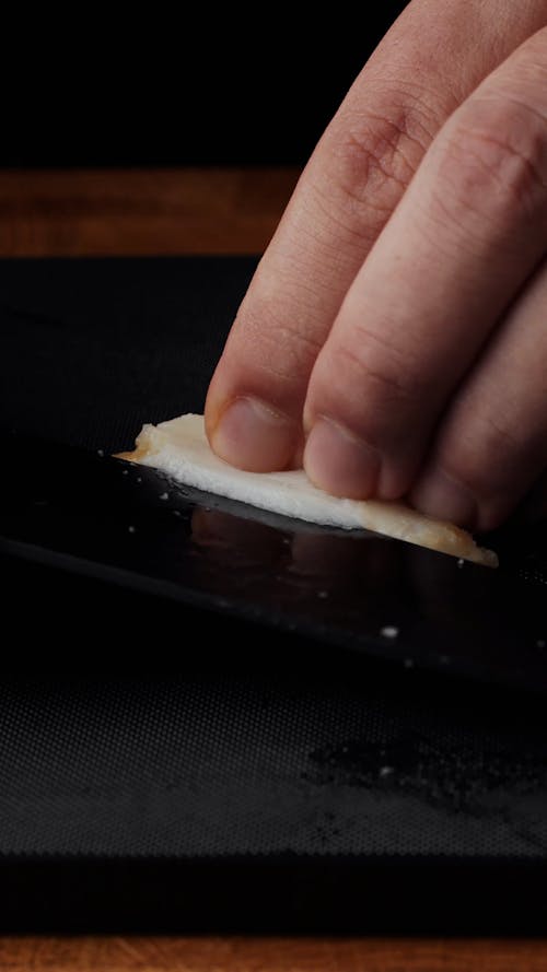 A Person Preparing Seafood Sashimi