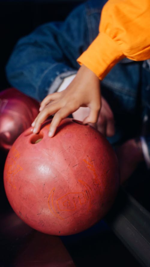 Close-up view of girl holding bowling ball