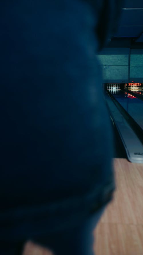 Redhead man in denim jacket bowling