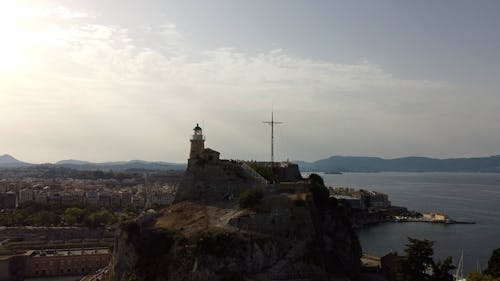 A Lighthouse and a Coastal Town