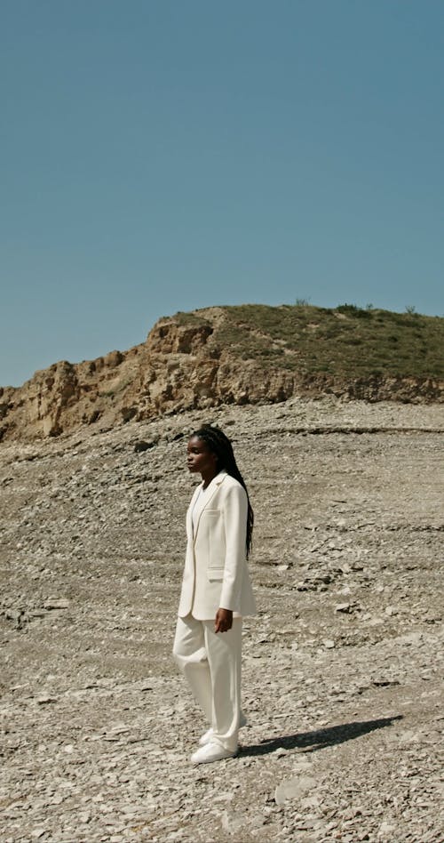 A Woman Walking by a Reservoir