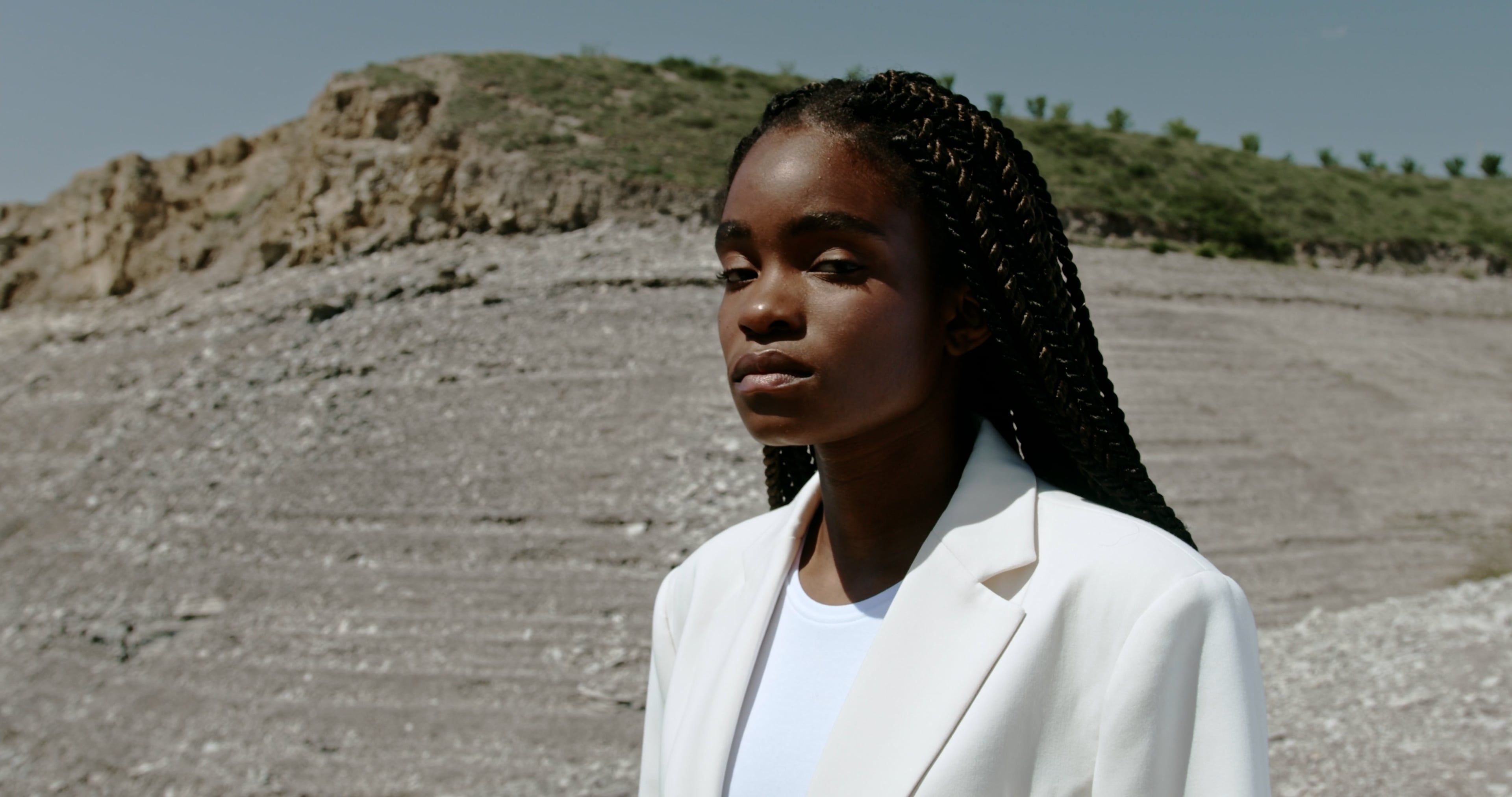 A Woman in a White Blazer Looking at the Camera Free Stock Video ...