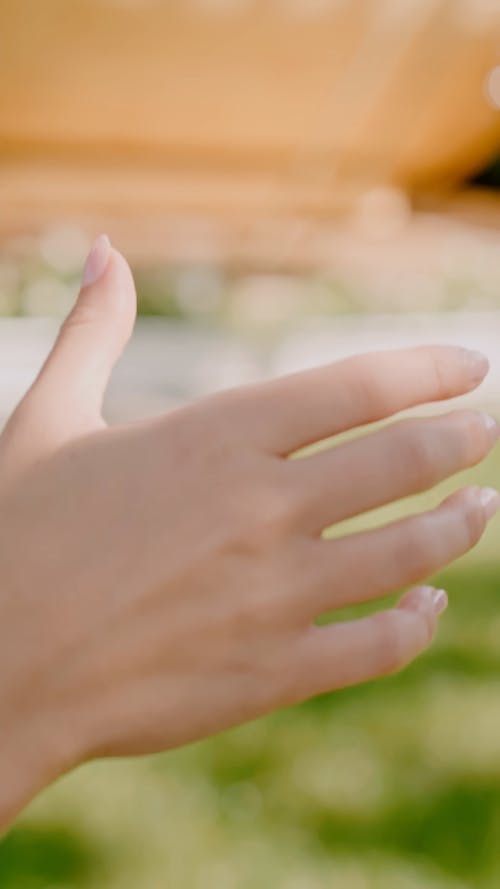 Close-Up Video of a Person Holding a Cocktail Drink