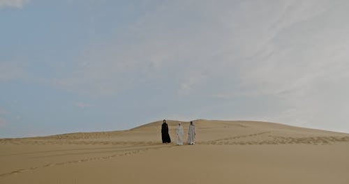 Three Women Running on Desert