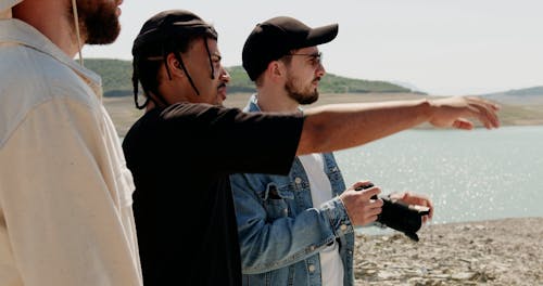 Group of Tourists Looking at View on Lakeshore