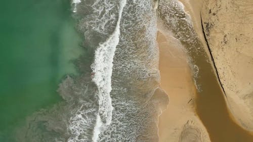 Sea Waves Reaching Sand Beach