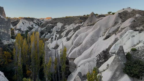 Lots of Balloons Above Rock Formations