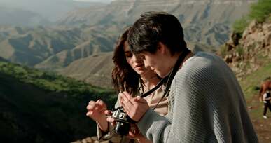 women holding a camera