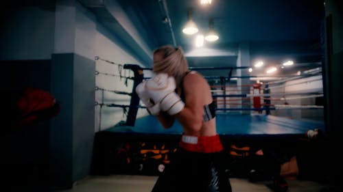 Woman Inside a Gym Training in Boxing