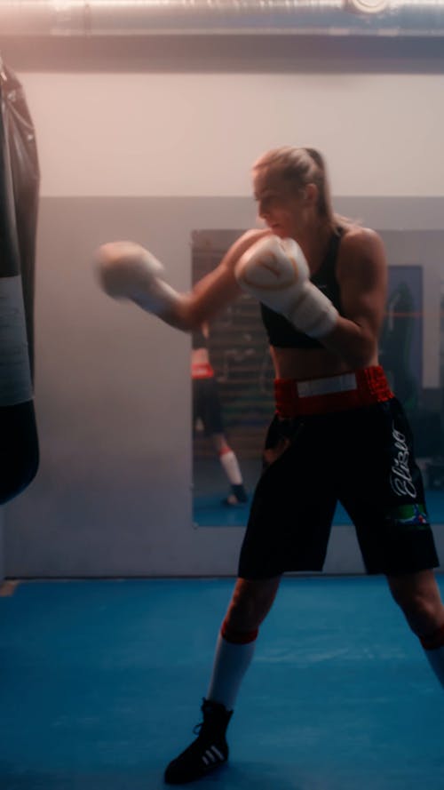 A Boxer Punching a Heavy Bag 