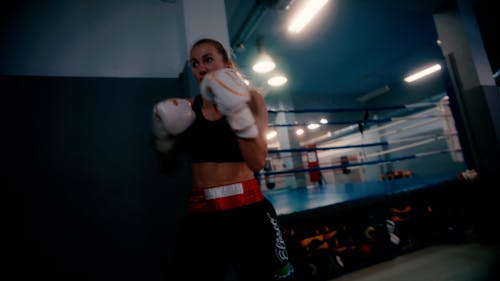 Woman Training in Boxing in a Gym