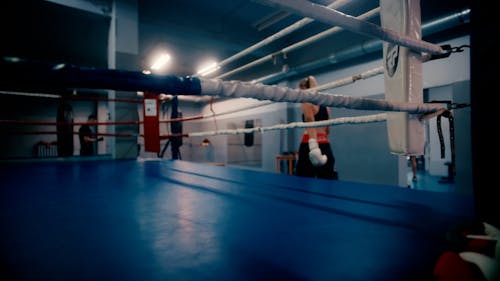 A Woman Getting Inside the Boxing Ring 