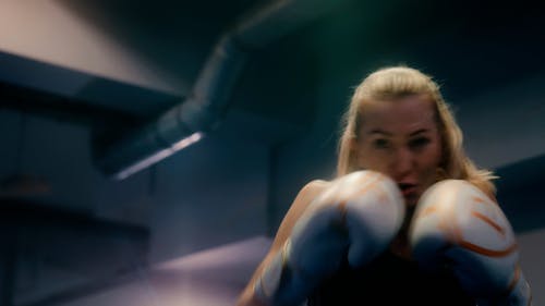 A Female Boxer Shadowboxing