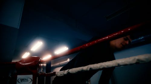 A Young Man Entering a Boxing Ring 