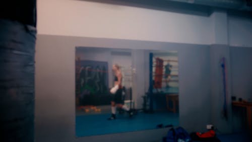 A Woman Hitting the Punching Bag