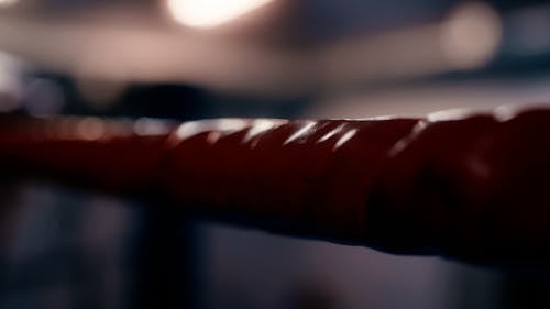 A Person Touching a Rope of a Boxing Ring 