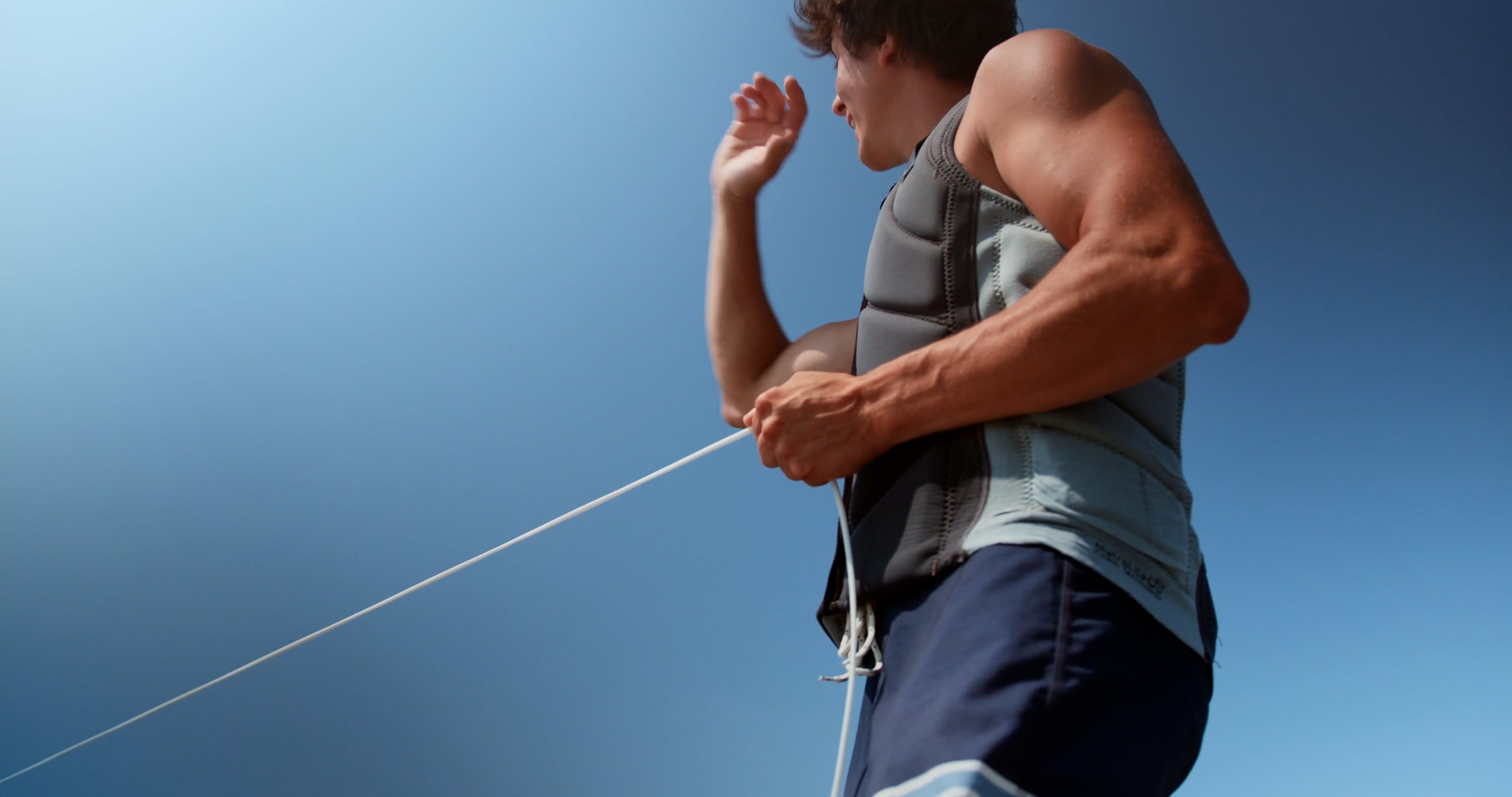 Low Angle Shot of a Man Holding a Line while Doing Hand Gestures Free ...