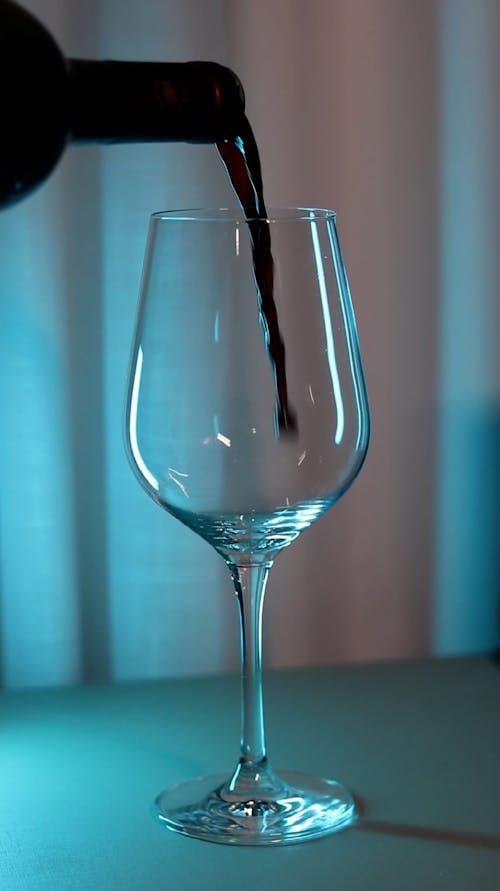 Close up on Wine Being Poured into Glass