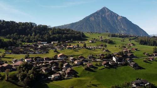 Aerial View on Village near Mountain