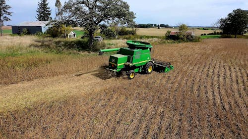 Drone Shot of Combine Harvester in Field